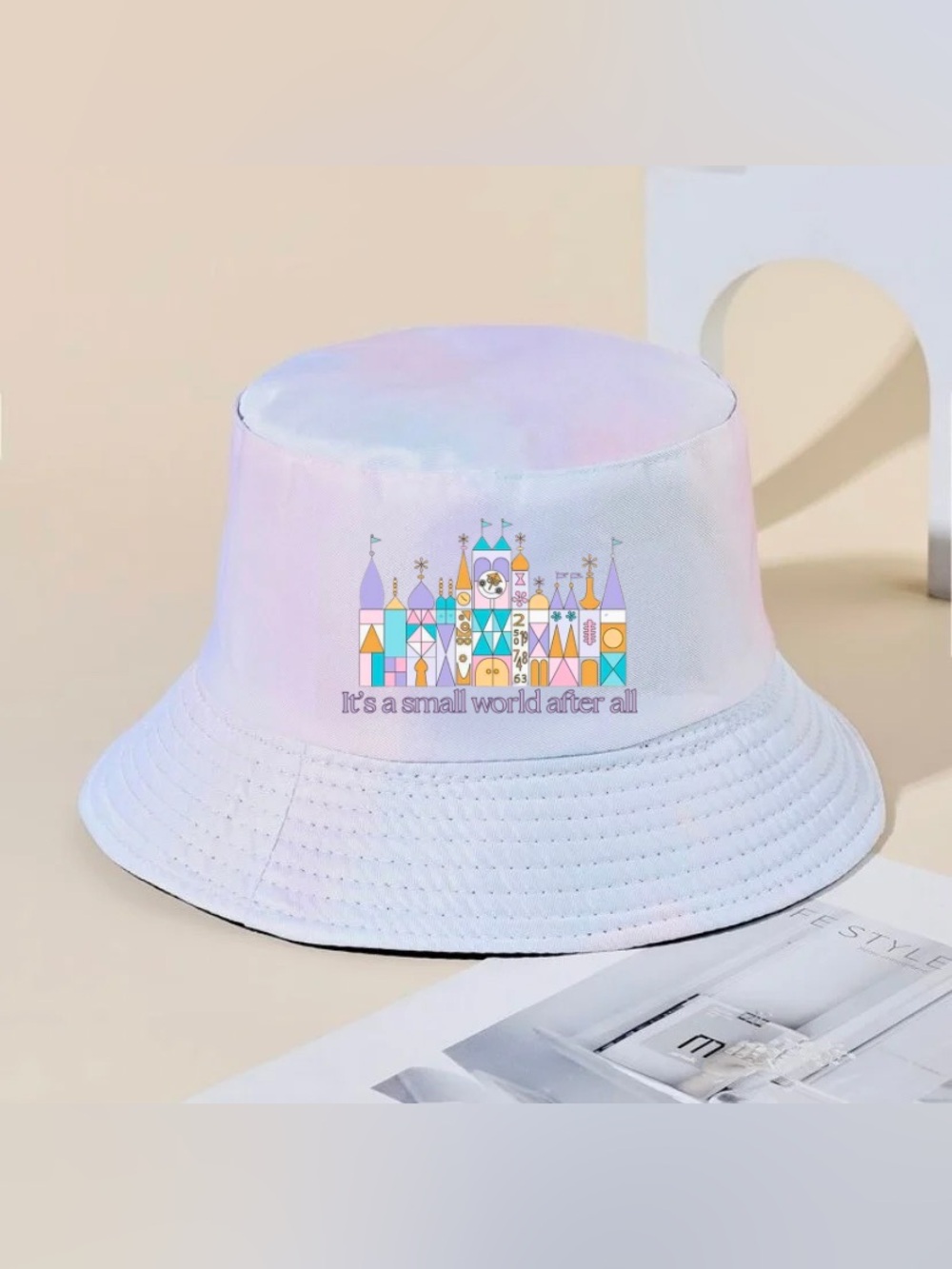 Pastel tie dye “It’s a Small World” bucket hat